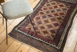 Vintage Belouch rug, geometric guls and borders on natural camel field.