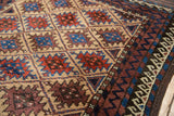 Belouch rug with natural camel field, red and blue serrated guls, and geometric borders.