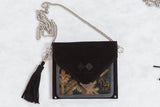 Black suede Antique Turkish Rug Fragment Bag with silver chain, hand-knotted bird motif, and hard-to-find colors.