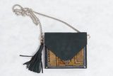 Antique Caucasian rug fragment bag with rare yellow, orange, geometric pattern and dark suede.