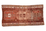 Antique Caucasian runner rug with distressed triple geometric medallions in bronze, copper, and ivory.