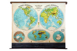 1930s vintage Cram's pull down map, depicting world hemispheres in muted green, blue, and brown.