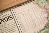 Detail of the Cram's Illinois map displaying the 1930s population table and colorful geography.