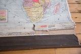 Vintage 1937 Cram's Africa map showing rolled bottom edge with paper separation.