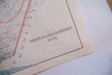 Detail of antique map's title and copyright, showing aged paper and binding perforations.
