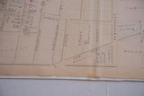 Aged paper and historic layouts of Grand Court on an antique White Plains map.
