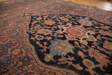 Superb curvilinear motifs of antique Bijar rug in charcoal blue, terra-cotta, and light blue.