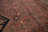 Fine curvilinear floral execution on antique Bijar carpet in terra-cotta and charcoal blue.