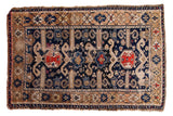 Antique Perpedil Caucasian rug, navy blue, burnt orange and beige geometric rams horn design.