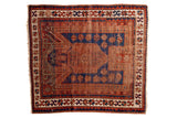 Antique Sewan Caucasian square rug with an indigo blue prayer niche and madder root red star and crab border.