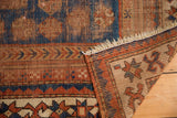 Antique Sewan Caucasian rug, indigo blue, madder red star and crab border, hand-knotted foundation.