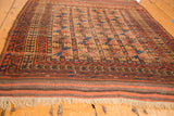 Antique Belouch rug with quadruple column geometric motif in madder red, navy, and camel. 3' x 4'2