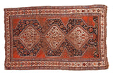 Antique Qashqai rug, triple medallions on navy and madder red fields, 4'2