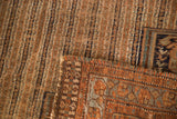 Kamseh rug's striped chestnut brown field, geometric pale copper border, tattered fringe.