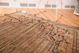 Vintage Kamseh rug's textured pile featuring parallel stripes and water motif.