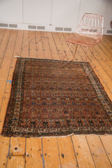 Vintage Hamadan rug's intricate madder red field with allover leaf motifs and border.