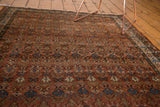 Vintage Hamadan rug, intricate madder red field with blue and beige traditional plant motifs.