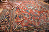 Vintage Mahalati carpet with intricate geometric borders and scrolling floral palmettes in blue, ivory, and brick.