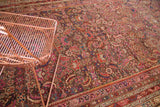 Antique Karabagh runner's intricate Herati pattern, featuring plum, madder red, and ink blue.