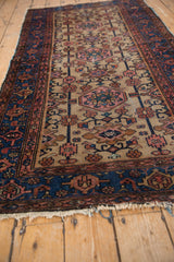 Rich indigo blue border and geometric floral field patterns on a vintage Hamadan rug.