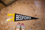 Bedford NY Felt Pennant, black with white letters and yellow side.