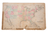 Antique Rand McNally USA map, vibrant pastel states, visible aging, tears, and folds.