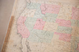 Detail of the late 19th century Rand McNally USA map, showing western and central states in pastel pink and blue.