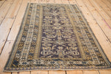 Angled view of a collector Perpedil style Shirvan rug highlighting its full geometric layout.