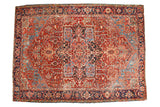 Antique Heriz carpet, cherry red field, sky blue quatrefoil medallion, detailed floral vinery.