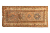 Antique Caucasian runner with geometric palmettes, border birds, in faded saffron, charcoal, and blush colors.