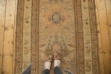 Antique Caucasian runner shows oversized geometric palmettes, border birds, faded saffron, silver, blush.