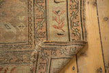 Antique Caucasian runner's folded corner, showing wool foundation and tattered end.