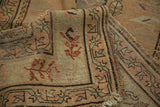Antique Caucasian runner with frayed fringe, worn pile, and geometric border.