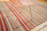 Vintage hand woven Kilim rug detail: faded red, mauve, and blue striped bands.