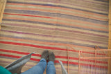 Vintage Turkish Kilim, horizontal bands of time-softened red, mauve, silver, and blue.