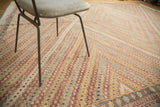 Vintage Turkish jijim carpet featuring geometric diamond patterns in slate blue and wine red.