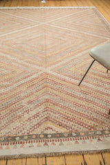 Hand knotted Turkish jijim rug's intricate geometric border and repeating diamond pattern.