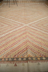 Hand knotted Vintage Turkish Jijim carpet's diamond pattern meets a dark, detailed geometric border.
