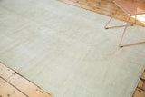 Vintage Oushak carpet featuring snow white and pale beige, with subtle tone-on-tone wear.