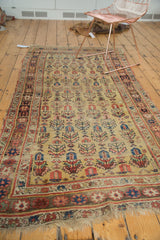 Storied tattered fringe and madder root red border on an antique Kurdish Bijar rug.