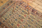 Antique Kurdish Bijar rug corner with blossoming tree design, saffron field, and characterful pile.