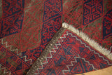 Tattered light fringe and original triple cord goat hair selvage on a Vintage Belouch rug.