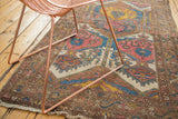 Vintage Lilihan rug detail: expressive cloudband and palmette motifs in blush, teal, saffron.