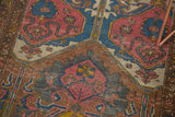 Persian Lilihan rug detail featuring multi-panel design, blush palmettes, and expressive blue cloudbands.