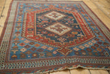 Antique Afshar rug corner, low pile, tattered ends, indigo, pomegranate red, watery blue borders.
