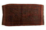 Dramatic vintage hand-knotted Belouch rug, geometric patterns in rich madder red, navy, brown.
