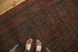 Belouchi rug's tribal geometric pattern in rich madder root red, navy blue, and chocolate brown.