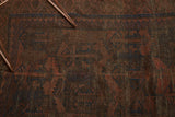 Belouchi rug showing rich madder red, navy geometric patterns, and mostly even wear.