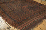 Vintage Belouch rug, secure striped flat-weave end with rich madder red and dark brown tones.