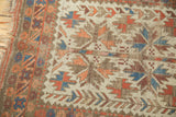 Geometric leaf pattern in red, blue, brown on rare ivory field and patterned border.